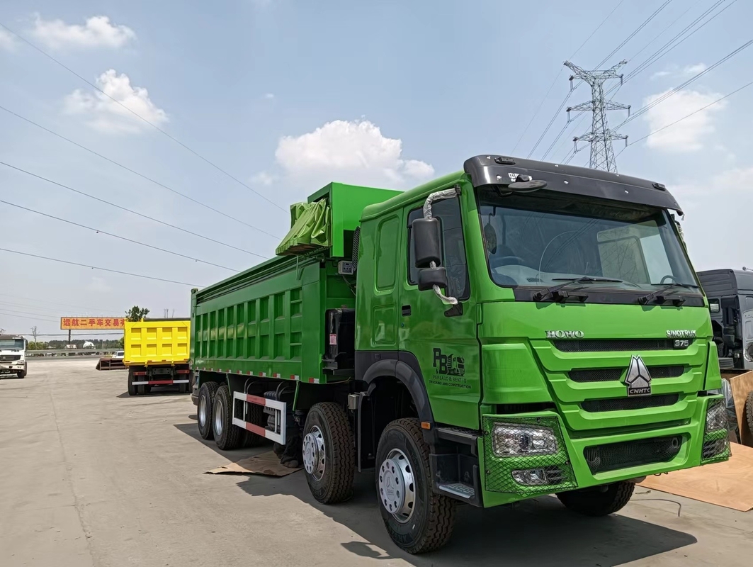 Truk Dumper yang Digunakan di Zimbabwe Sinotruk Howo Leaf Spring 30CBM Box Hand Drive