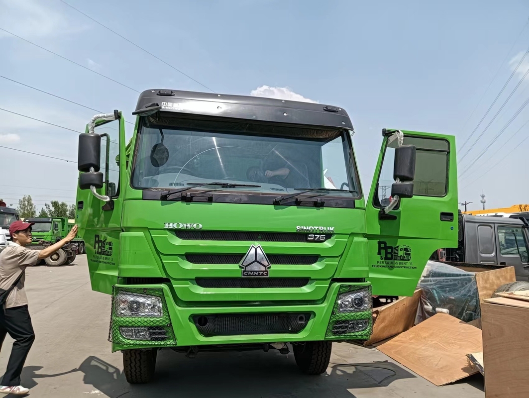 Truk Dumper yang Digunakan di Zimbabwe Sinotruk Howo Leaf Spring 30CBM Box Hand Drive