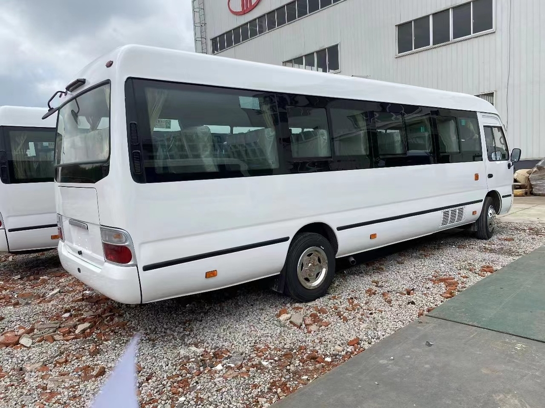 Bus Minibus Mudan 30 Seater Pengemudi Tangan Kanan Penggunaan Di Tanzania Leaf Spring Untuk Jalan yang Buruk