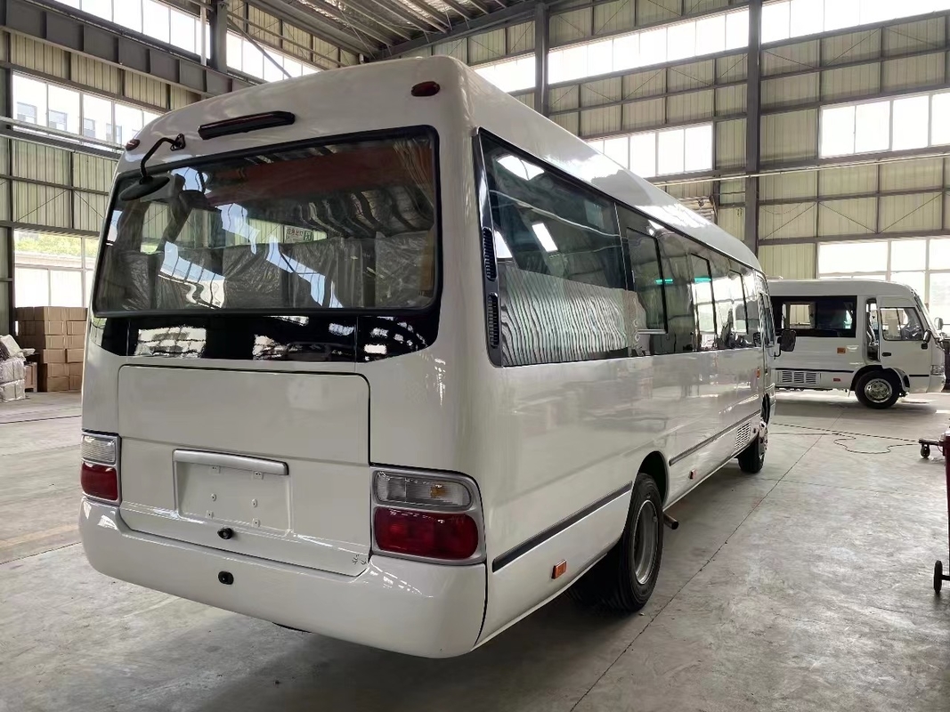 Bus Minibus Mudan 30 Seater Pengemudi Tangan Kanan Penggunaan Di Tanzania Leaf Spring Untuk Jalan yang Buruk